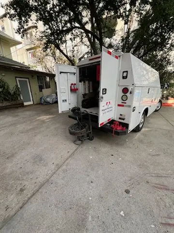 Magnet Plumbing service vehicle on-site for Grease Trap Cleaning in The Courtyards